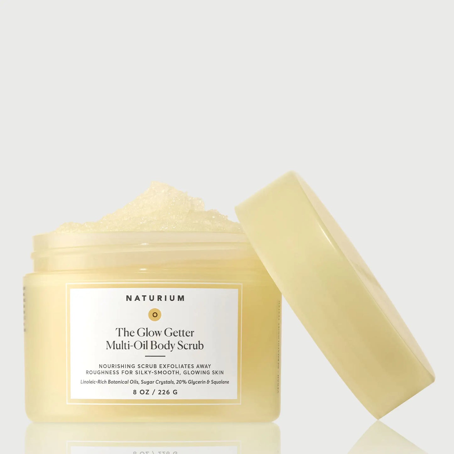 the-glow-getter-multi-oil-body-scrub-e6 NATR-40028-GlowGetter-Multi-Oil-Body-Scrub-Front-CapOff-bonebkgd.webp