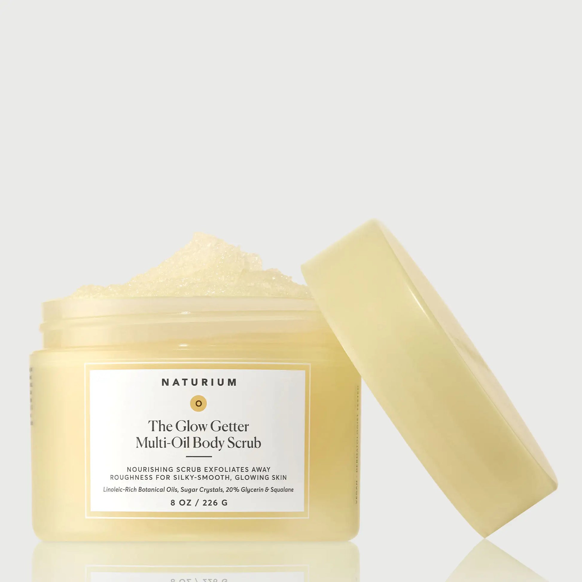 the-glow-getter-multi-oil-body-scrub-e6 NATR-40028-GlowGetter-Multi-Oil-Body-Scrub-Front-CapOff-bonebkgd.webp